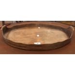 An old brass-bound oval tray with wavy e
