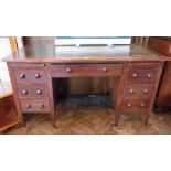 An early 20th century oak kneehole desk,
