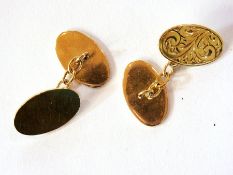 A pair of 9ct gold cufflinks, oval, foli
