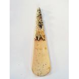 Oriental carved ivory shoe horn with car