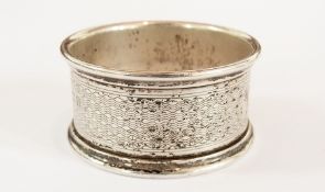 A 19th century silver napkin ring of eng