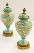 A pair of Sevres porcelain lidded urns w