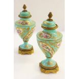 A pair of Sevres porcelain lidded urns w