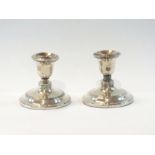 A pair of George V silver candlesticks w