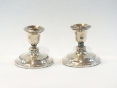 A pair of George V silver candlesticks w