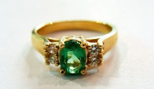 Emerald and diamond ring set centre oval