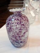 An ovoid-shaped studio glass vase with w