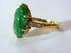 9ct gold and carved green jadeite ring,