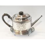 A George III silver teapot of oval form