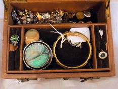 A leather jewellery box with costume jew
