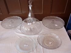 Three cake stands, a wine decanter and o