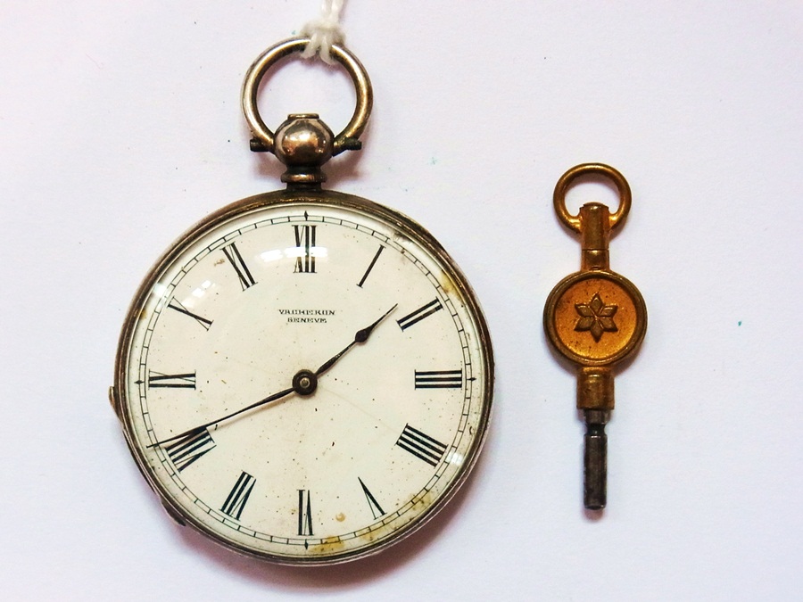 A silver open-faced pocket watch with en