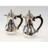 A pair of Edwardian silver lidded pots o