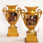 A pair of Continental porcelain pedestal two-handled vases with painted panels of taverns Live