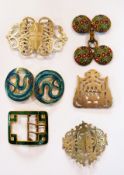 A quantity of decorative buckles includi