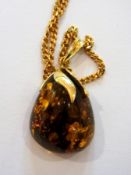 Amber pendant with 14K gold mount and th