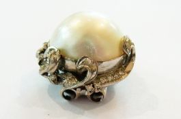 Large pearl and diamond brooch, the sing