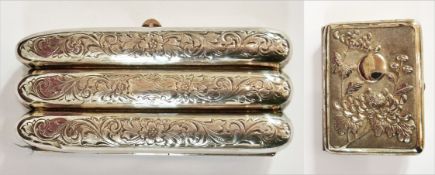 A white metal triple cigar case with fol