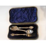 An Edwardian silver spoon and fork prese