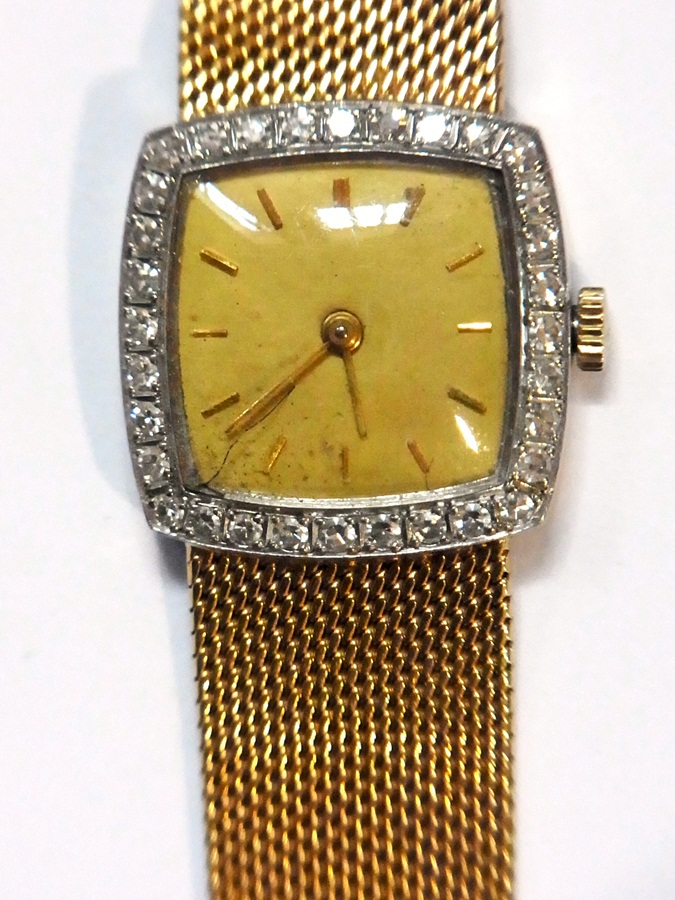 A 18ct gold and diamond set lady's wrist
