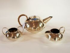 A silver plate teapot of compressed form