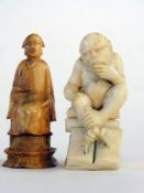 Carved ivory okimono of a monkey seated