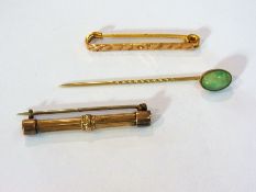 Foreign gold-coloured metal stick pin wi