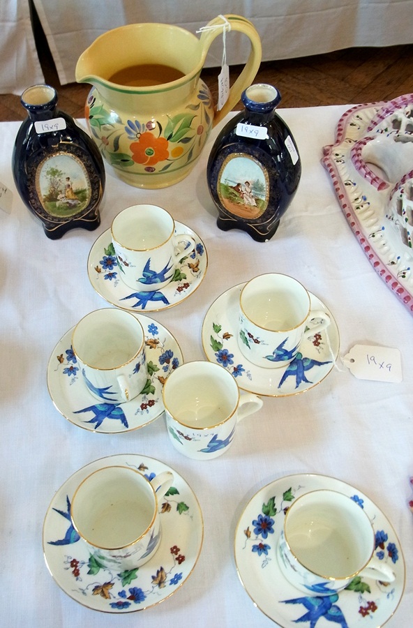 Six porcelain coffee cups with five sauc