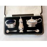 Silver condiment set, each raised on squ