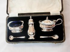 Silver condiment set, each raised on squ