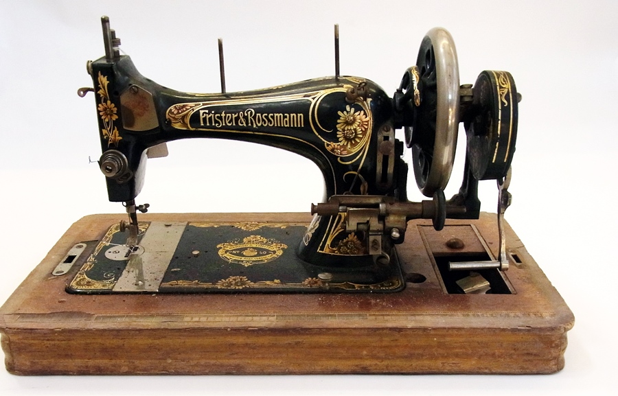 A Frister & Rossmann sewing machine also labelled "Harrods Limited, Brompton Road, SW", in wooden