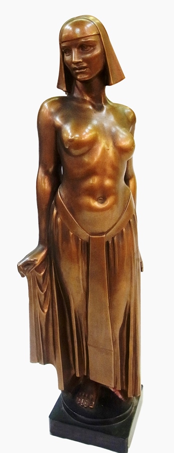 A early 20th century Art Deco bronze-painted plaster figure of a partially draped woman, on black