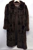 A vintage fur coat with pockets and bell