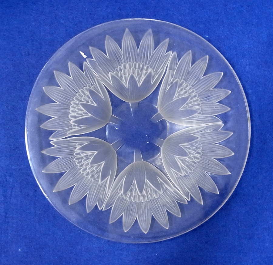 A modern glass dish engraved with sunflo
