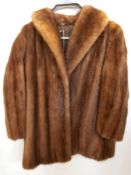 A mink jacket with shawl collar