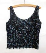 A heavily beaded top with sequins, beads