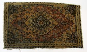 Small Tabriz mat with floral and leaf filled arabesque to centre, 85cm long