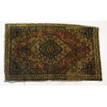 Small Tabriz mat with floral and leaf filled arabesque to centre, 85cm long