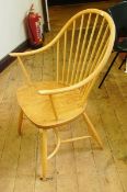 A set of six Ercol hoop and stickback arm chairs with crinoline stretchers