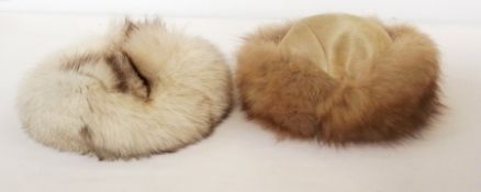 A Mitzi Lorenz white fox fur hat flecked