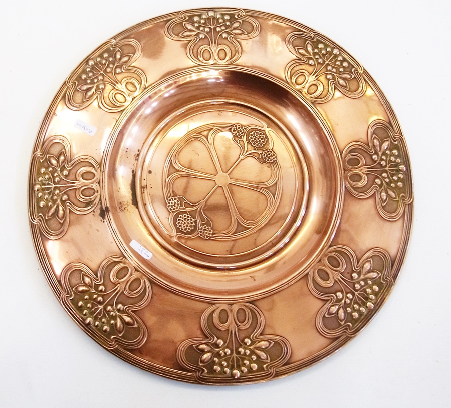 Art Nouveau embossed copper charger with