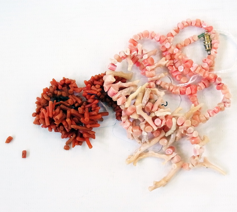 A pale pink long coral necklace and a sm