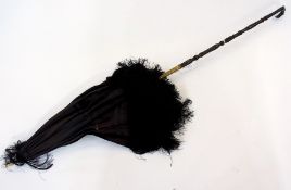 A lady's silk parasol with carved bone f