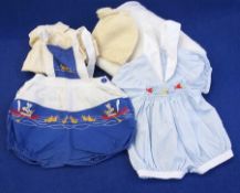 A selection of baby clothes including a