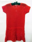 A vintage red crocheted mini dress