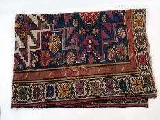 Lesghi rug with three stepped octagonal guls, on a midnight blue field, 150cm