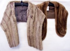 A brown mink stole together with another