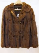 A vintage fur coat, possibly coney or sq