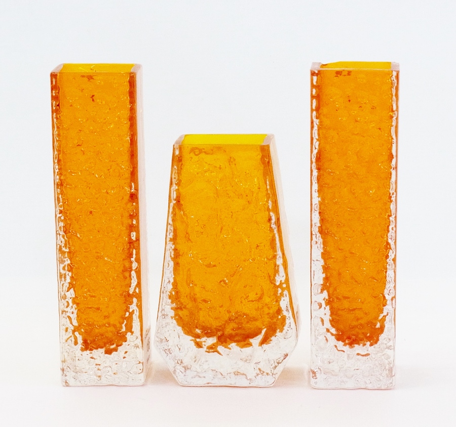 A Whitefriars coffin-shaped tangerine vase, 13cm and two other Whitefriars tangerine glass vases,