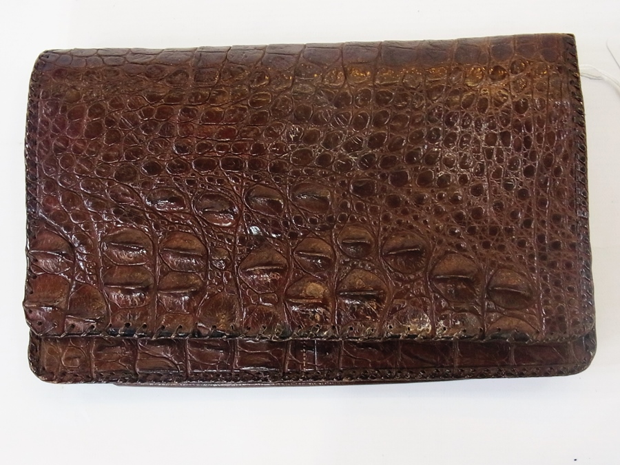 Alligator skin clutch bag fitted with ma
